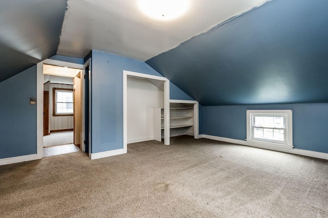 10 Colonial Ct, Portland, ME 04102 - additional living space with carpet flooring and vaulted ceiling
