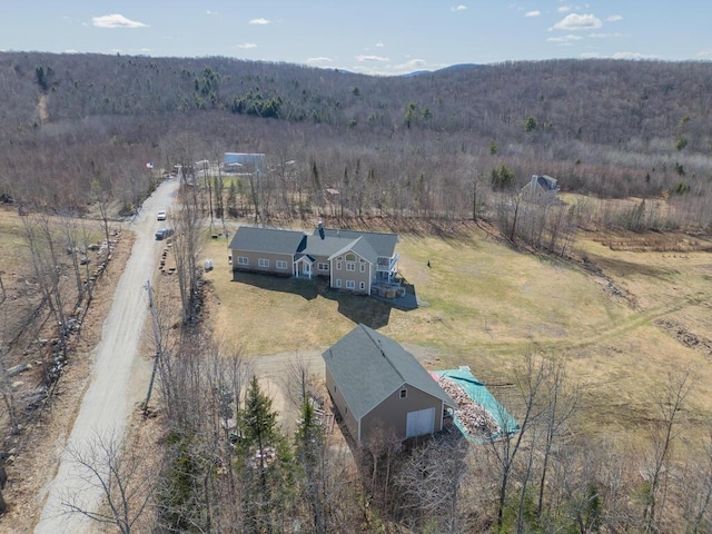 135 Lyle Hall Rd, Wilton, ME 04294 - overview of rural landscape featuring a heavily wooded area