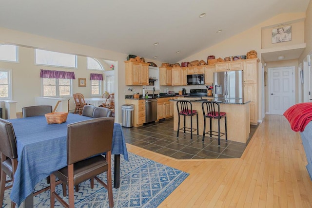 135 Lyle Hall Rd, Wilton, ME 04294 - dining room with dark wood-style floors, high vaulted ceiling, and recessed lighting