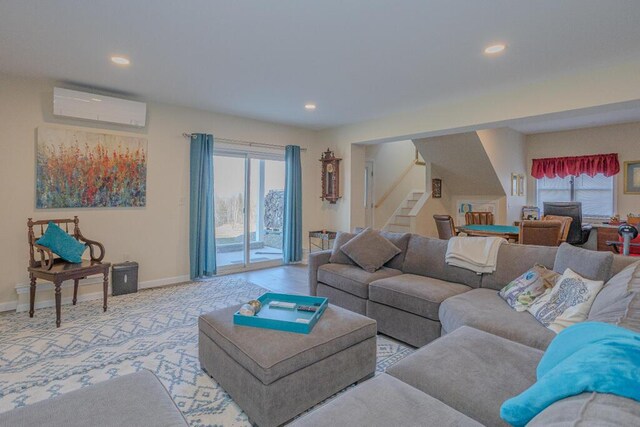 135 Lyle Hall Rd, Wilton, ME 04294 - living room featuring a wall unit AC, stairway, recessed lighting, baseboards, and light carpet