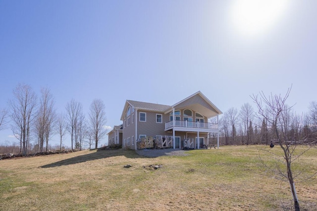 135 Lyle Hall Rd, Wilton, ME 04294 - back of property with a yard and a balcony