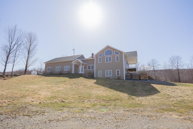 135 Lyle Hall Rd, Wilton, ME 04294 - back of property featuring a lawn