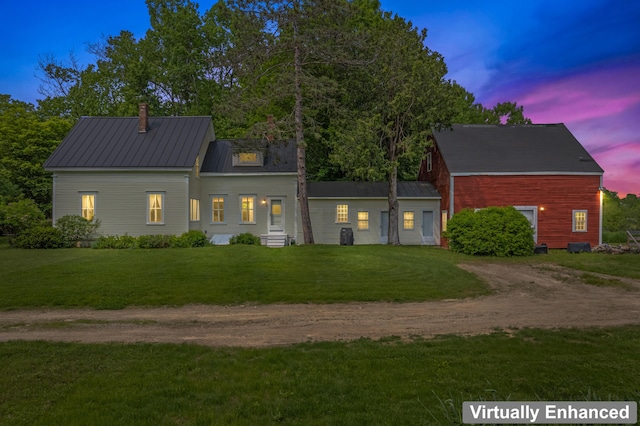 145 Pork Point Rd, Bowdoinham, ME 04008 - view of front facade with driveway, a front yard, entry steps, and metal roof