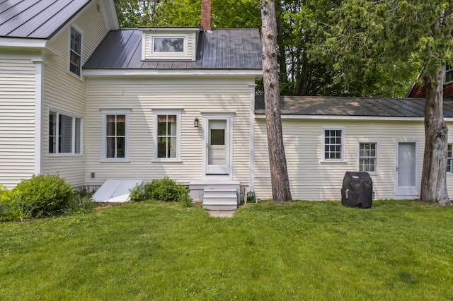 145 Pork Point Rd, Bowdoinham, ME 04008 - back of property with metal roof and a lawn
