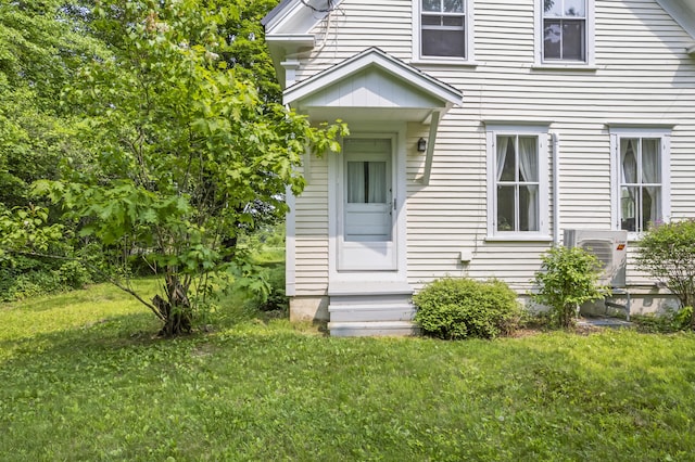 145 Pork Point Rd, Bowdoinham, ME 04008 - view of front of house with a front yard and a cooling unit