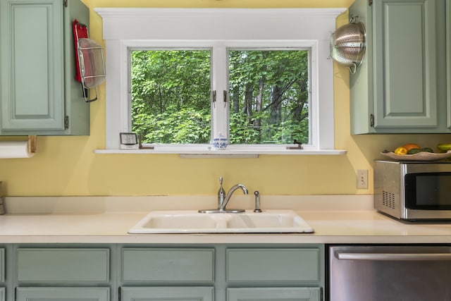145 Pork Point Rd, Bowdoinham, ME 04008 - kitchen featuring appliances with stainless steel finishes, a sink, light countertops, and green cabinetry