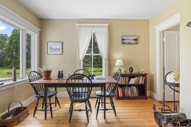 145 Pork Point Rd, Bowdoinham, ME 04008 - dining space featuring plenty of natural light, hardwood / wood-style floors, and baseboards