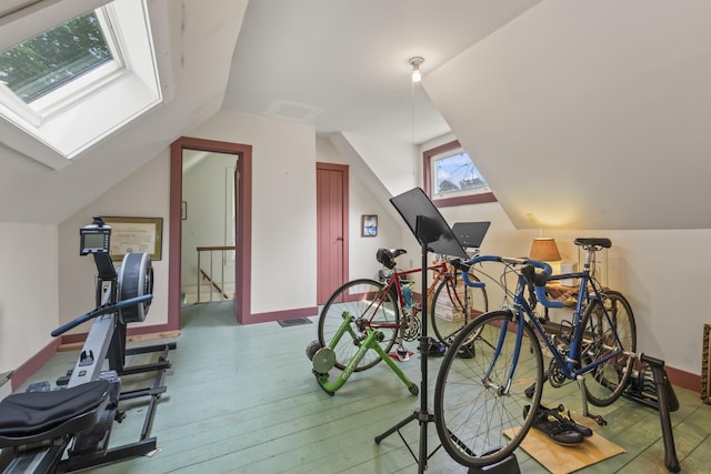 145 Pork Point Rd, Bowdoinham, ME 04008 - workout room with vaulted ceiling, wood-type flooring, and a skylight