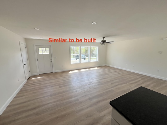 278 Merrill Rd, Levant, ME 04456 - unfurnished living room with a ceiling fan, light wood finished floors, and recessed lighting