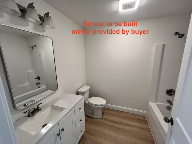 278 Merrill Rd, Levant, ME 04456 - bathroom featuring vanity, wood finished floors, and shower / washtub combination