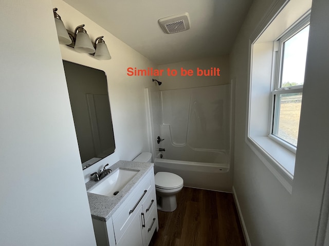 278 Merrill Rd, Levant, ME 04456 - bathroom with wood finished floors, vanity, and washtub / shower combination
