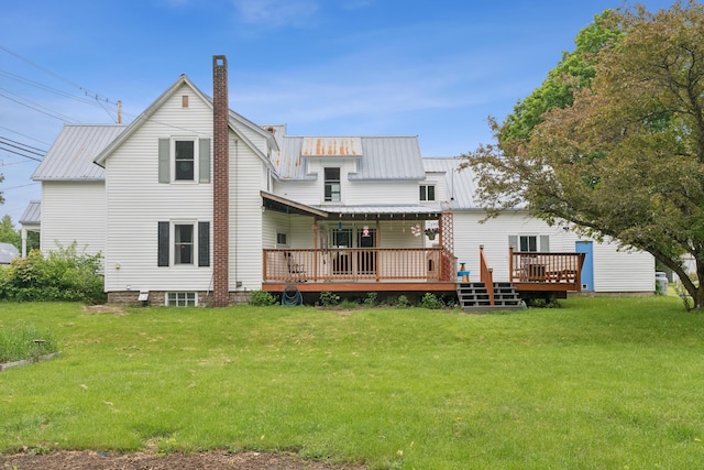 47 Beal St, Norway, ME 04268 - back of property featuring a deck, a chimney, and a yard