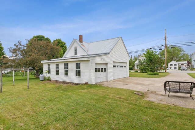 47 Beal St, Norway, ME 04268 - view of side of property featuring a lawn, a chimney, and metal roof