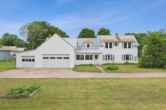 47 Beal St, Norway, ME 04268 - view of front of house with a chimney, a front lawn, driveway, and metal roof
