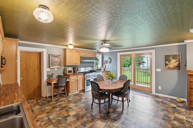 47 Beal St, Norway, ME 04268 - dining space with a ceiling fan, baseboards, ornamental molding, and dark stone finish flooring