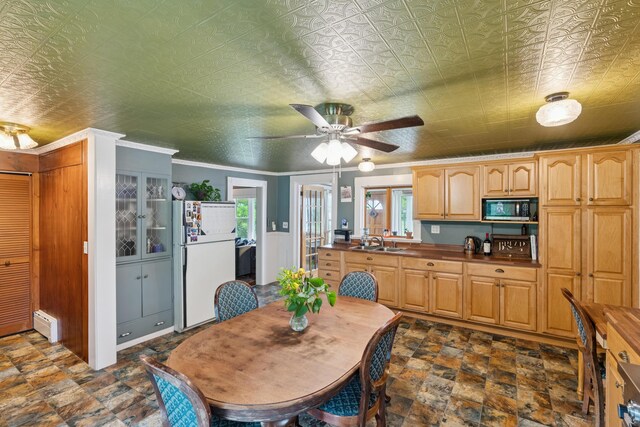 47 Beal St, Norway, ME 04268 - dining room featuring ceiling fan, dark stone finish flooring, and a baseboard radiator