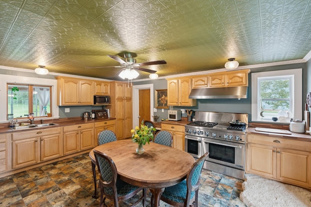 47 Beal St, Norway, ME 04268 - kitchen with under cabinet range hood, appliances with stainless steel finishes, a sink, plenty of natural light, and ornamental molding