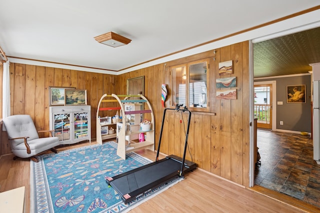 47 Beal St, Norway, ME 04268 - exercise area with crown molding, wood walls, baseboards, and wood finished floors