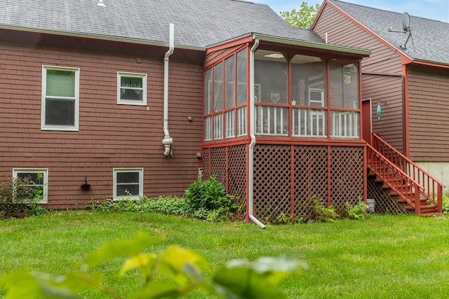 44 Cortland Cir Unit 44, Bangor, ME 04401 - back of property with a sunroom, a lawn, roof with shingles, and stairs
