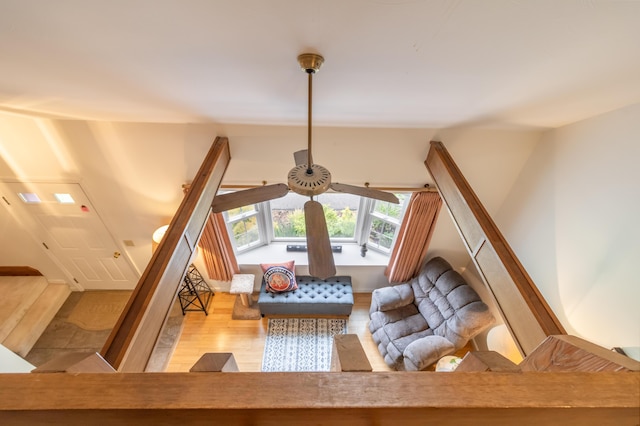 44 Cortland Cir Unit 44, Bangor, ME 04401 - living room featuring ceiling fan, wood finished floors, and stairs