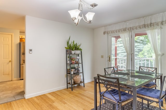 44 Cortland Cir Unit 44, Bangor, ME 04401 - dining space featuring a chandelier and light wood-style floors