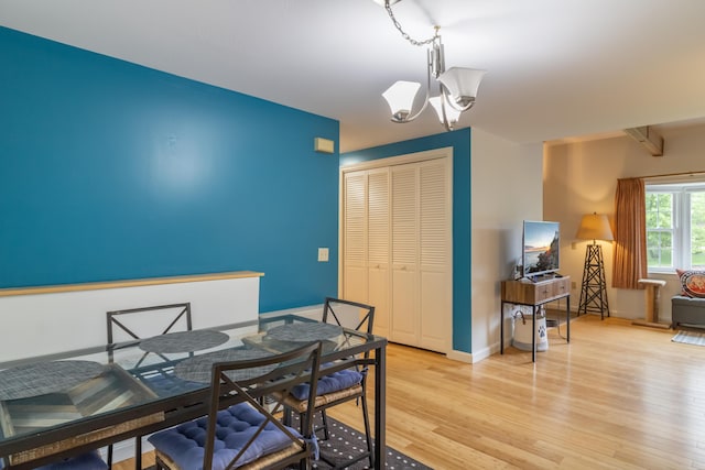 44 Cortland Cir Unit 44, Bangor, ME 04401 - dining space with a chandelier and light wood-style floors