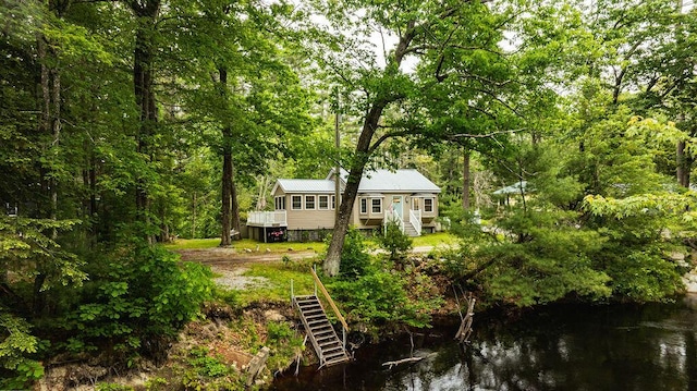 24 Dragon Back Rd, Naples, ME 04055 - rear view of property featuring stairway, a water view, and a metal roof
