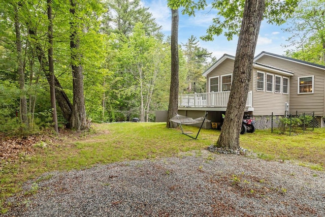 24 Dragon Back Rd, Naples, ME 04055 - view of grassy yard featuring a wooden deck
