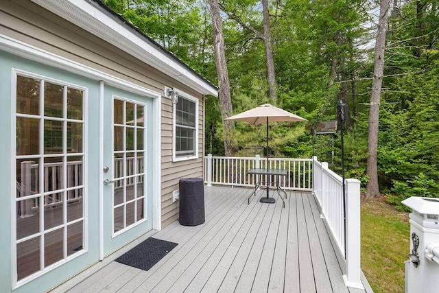 24 Dragon Back Rd, Naples, ME 04055 - wooden deck with french doors and view of scattered trees