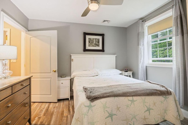 24 Dragon Back Rd, Naples, ME 04055 - bedroom with light wood-type flooring and a ceiling fan