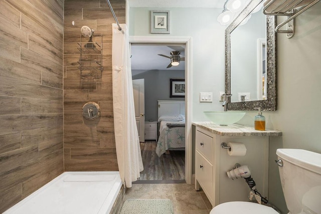 24 Dragon Back Rd, Naples, ME 04055 - ensuite bathroom featuring tiled shower, vanity, and a ceiling fan