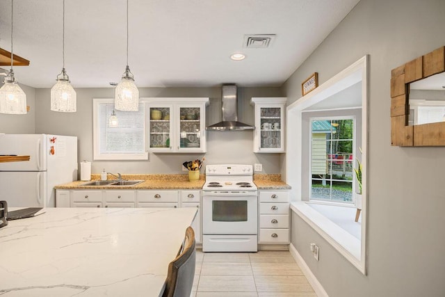 24 Dragon Back Rd, Naples, ME 04055 - kitchen featuring white appliances, wall chimney range hood, white cabinetry, hanging light fixtures, and light stone counters