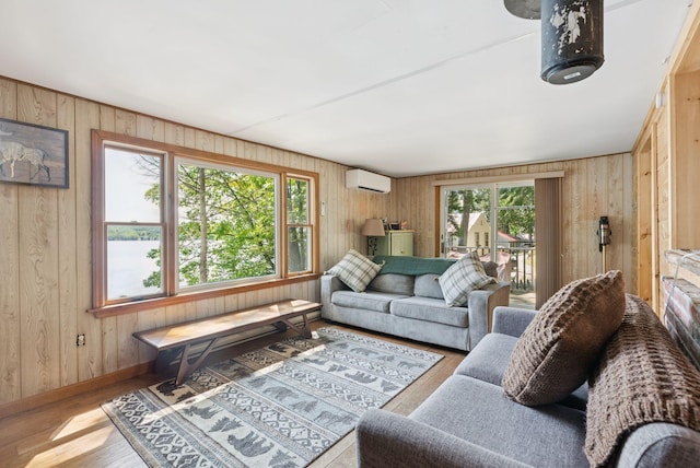 8 S Heritage Woods Ln, Winthrop, ME 04364 - living area featuring wooden walls, wood finished floors, a wall unit AC, and baseboards