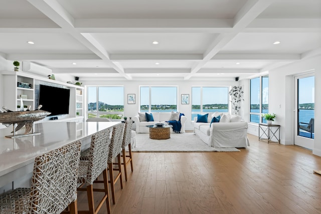218 Washington Ave Unit 401, Portland, ME 04101 - living area with coffered ceiling, wood-type flooring, recessed lighting, plenty of natural light, and beam ceiling