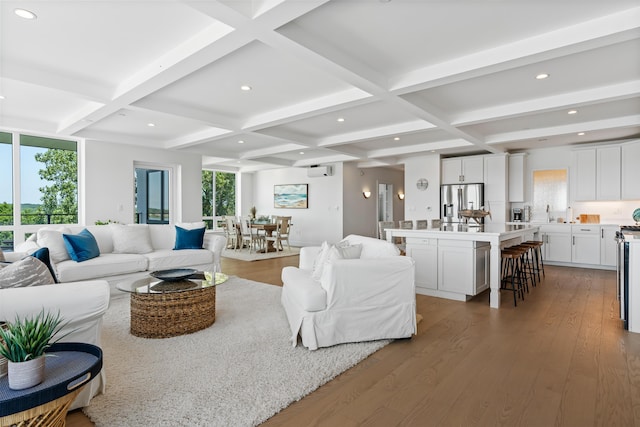 218 Washington Ave Unit 401, Portland, ME 04101 - living room with coffered ceiling, healthy amount of natural light, wood finished floors, beamed ceiling, and recessed lighting