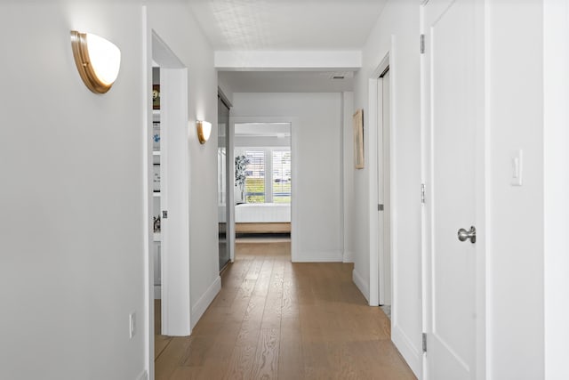 218 Washington Ave Unit 401, Portland, ME 04101 - corridor with baseboards and light wood finished floors