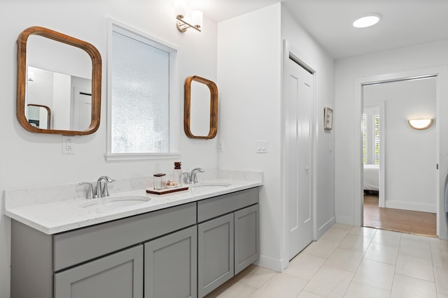 218 Washington Ave Unit 401, Portland, ME 04101 - bathroom featuring double vanity, ensuite bathroom, and tile patterned flooring