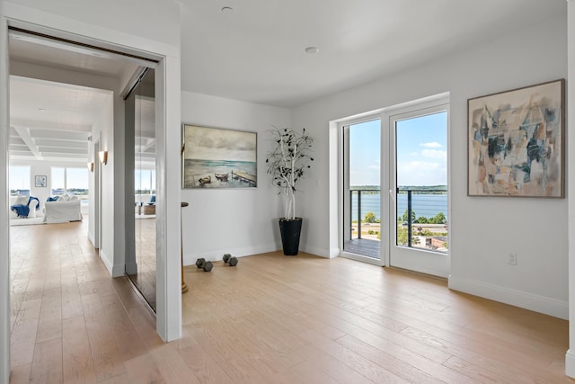 218 Washington Ave Unit 401, Portland, ME 04101 - interior space featuring light wood-style floors and a water view