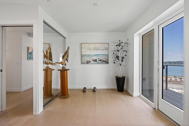 218 Washington Ave Unit 401, Portland, ME 04101 - spare room featuring light wood-style floors and baseboards