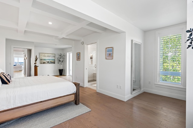 218 Washington Ave Unit 401, Portland, ME 04101 - bedroom featuring wood finished floors, beamed ceiling, coffered ceiling, recessed lighting, and ensuite bathroom