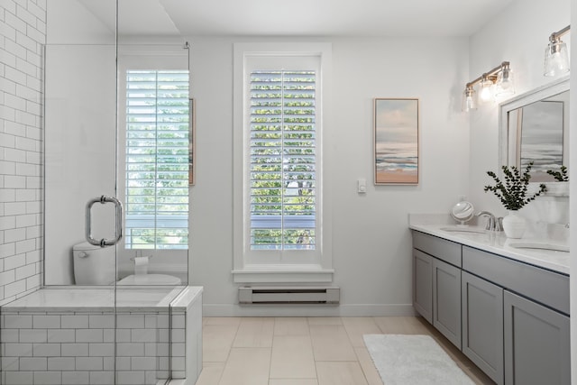218 Washington Ave Unit 401, Portland, ME 04101 - full bathroom featuring a baseboard heating unit, double vanity, and healthy amount of natural light