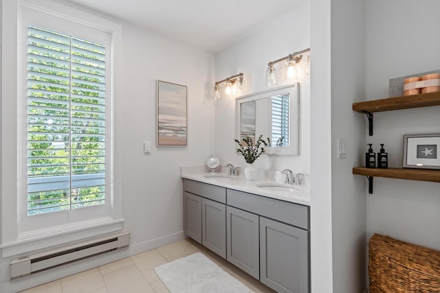 218 Washington Ave Unit 401, Portland, ME 04101 - bathroom featuring a baseboard radiator, double vanity, and tile patterned flooring