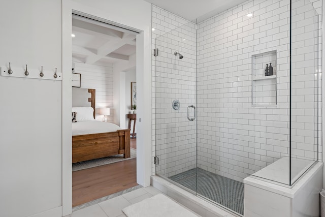 218 Washington Ave Unit 401, Portland, ME 04101 - ensuite bathroom featuring coffered ceiling, a stall shower, beamed ceiling, and tile patterned floors