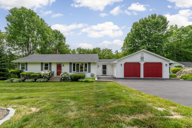 369 Grove St, Lewiston, ME 04240 - ranch-style home featuring a garage, driveway, a chimney, and a front yard