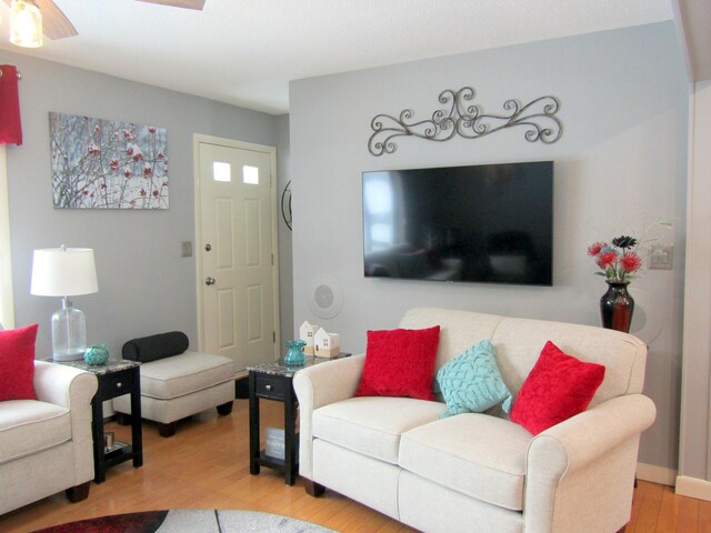 369 Grove St, Lewiston, ME 04240 - living area with wood finished floors and a ceiling fan