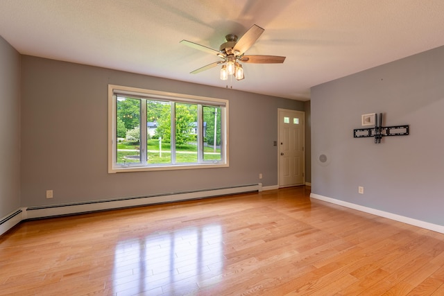 369 Grove St, Lewiston, ME 04240 - unfurnished room featuring light wood-type flooring, a ceiling fan, baseboards, and a baseboard heating unit