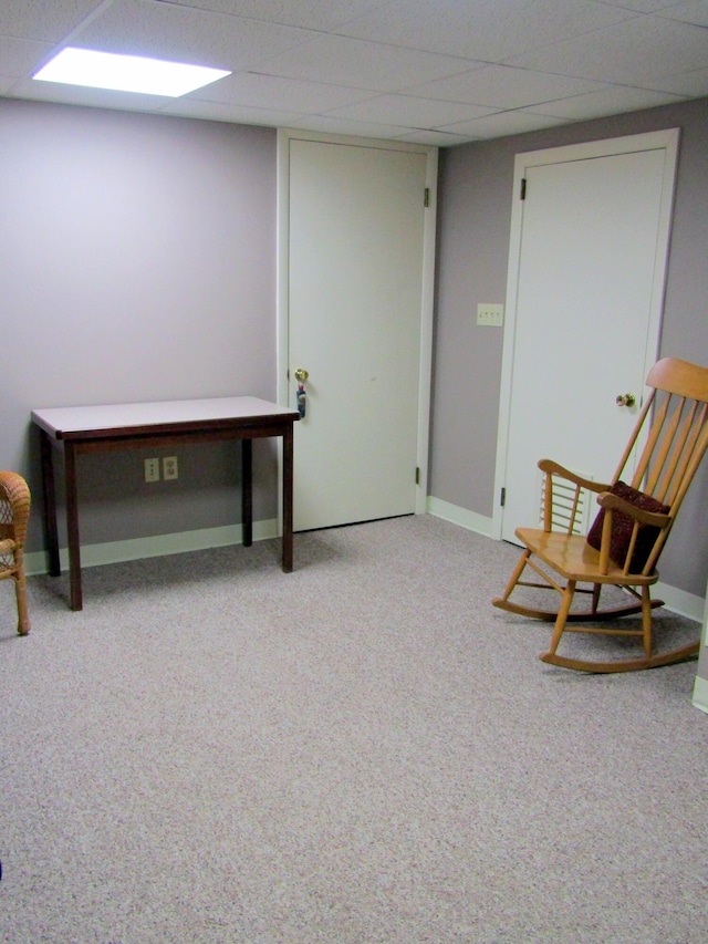 369 Grove St, Lewiston, ME 04240 - living area featuring carpet flooring, a paneled ceiling, and baseboards