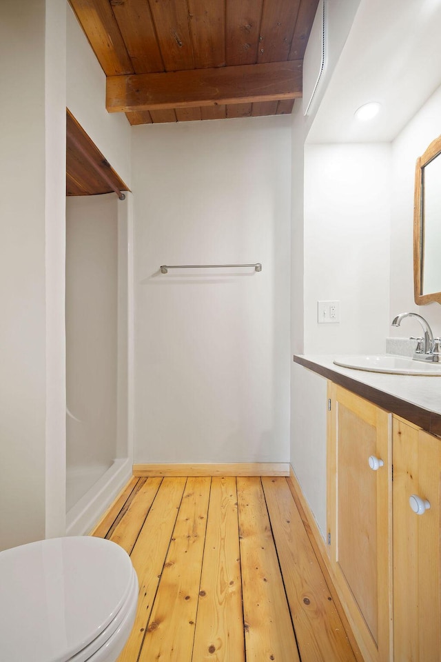 427 Haley Rd, Kittery, ME 03905 - full bathroom featuring vanity, wood-type flooring, toilet, wooden ceiling with exposed beams, and baseboards
