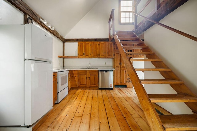 427 Haley Rd, Kittery, ME 03905 - kitchen with white appliances, light countertops, brown cabinets, open shelves, and high vaulted ceiling