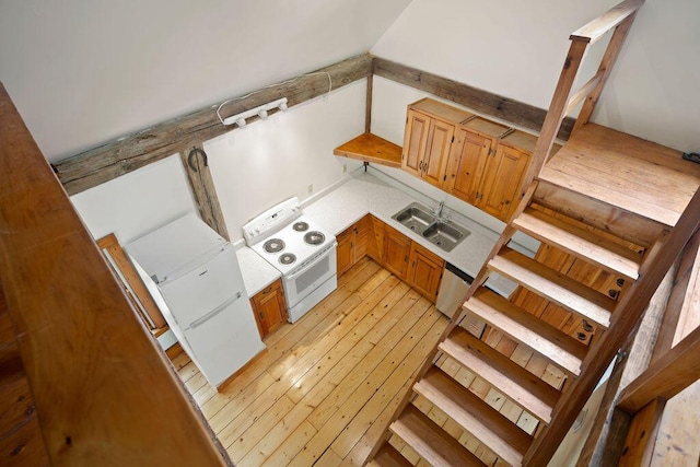 427 Haley Rd, Kittery, ME 03905 - kitchen with white range with electric cooktop, a sink, dishwasher, and light wood-type flooring